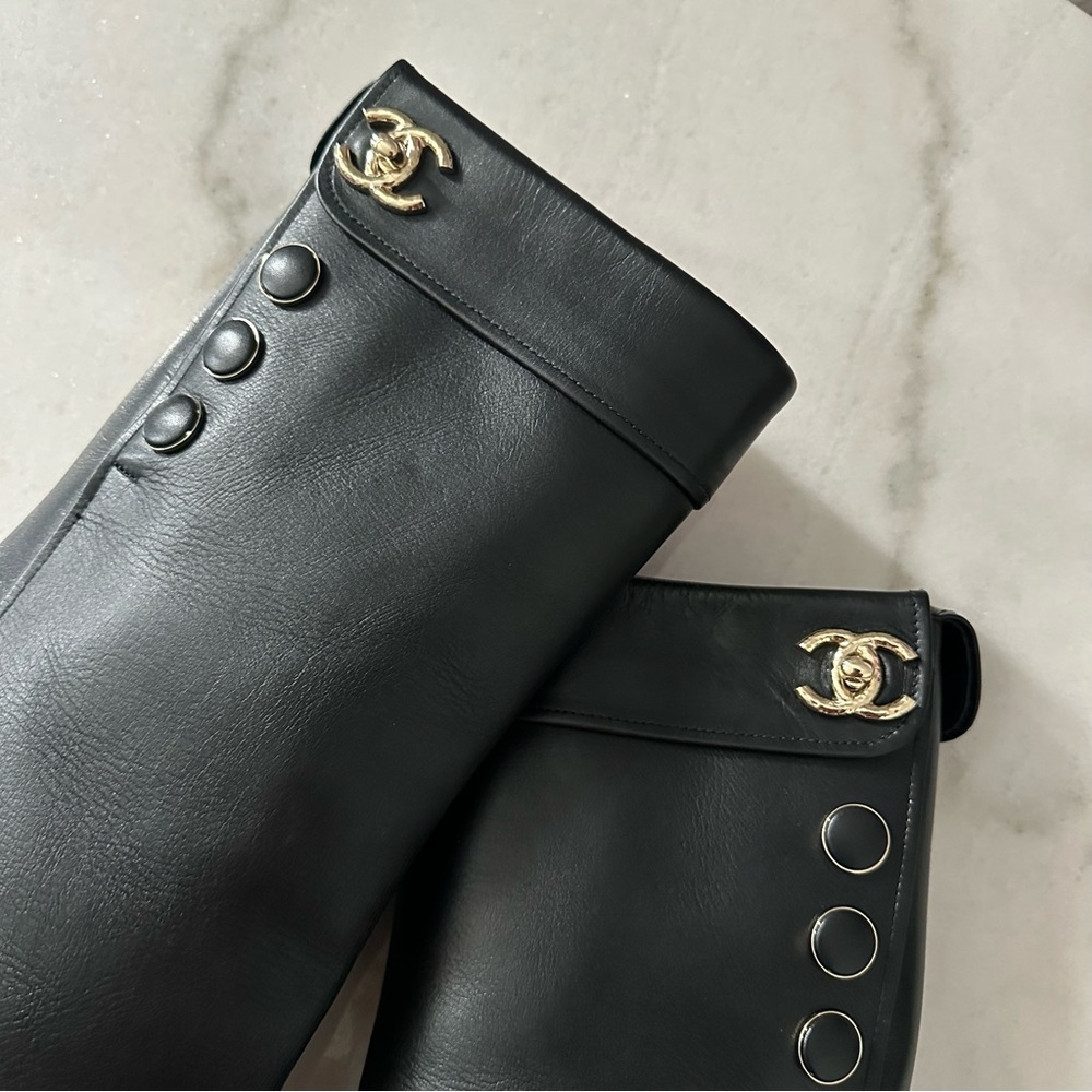 CHANEL Black Leather Knee-High Boots with Gold CC Accent - Picture 2 of 8